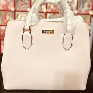 NWT Light pink KATE SPADE leather hand purse with shoulder strap.